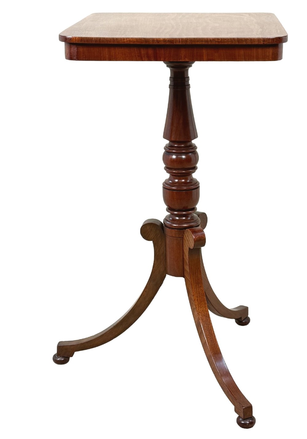 A Regency period mahogany wine table with a rectangular top, a turned central pedestal column, and three splayed legs ending in ball feet. View II