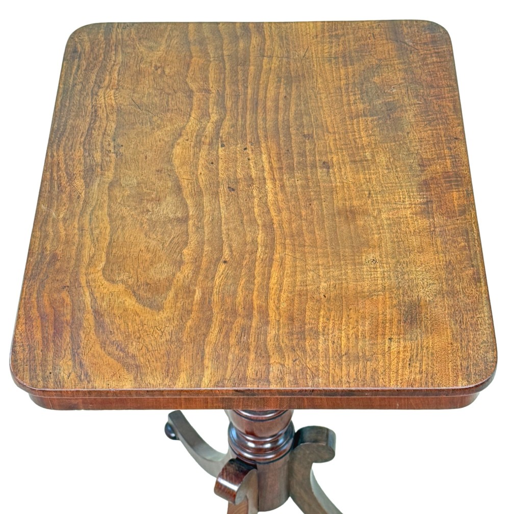 A Regency period mahogany wine table with a rectangular top, a turned central pedestal column, and three splayed legs ending in ball feet. View III