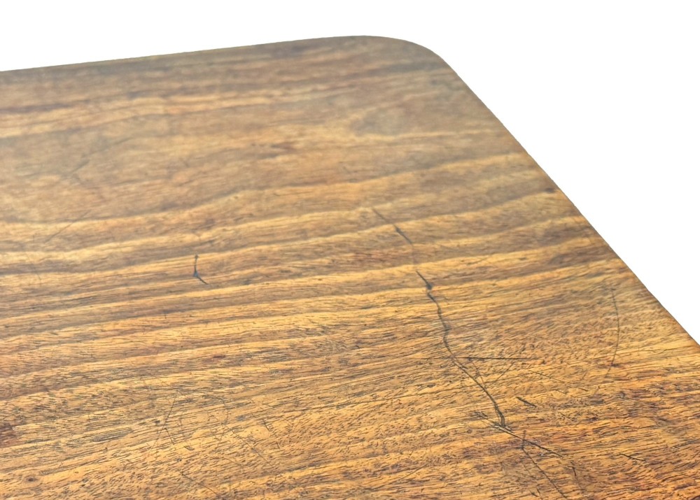 A Regency period mahogany wine table with a rectangular top, a turned central pedestal column, and three splayed legs ending in ball feet. View VI