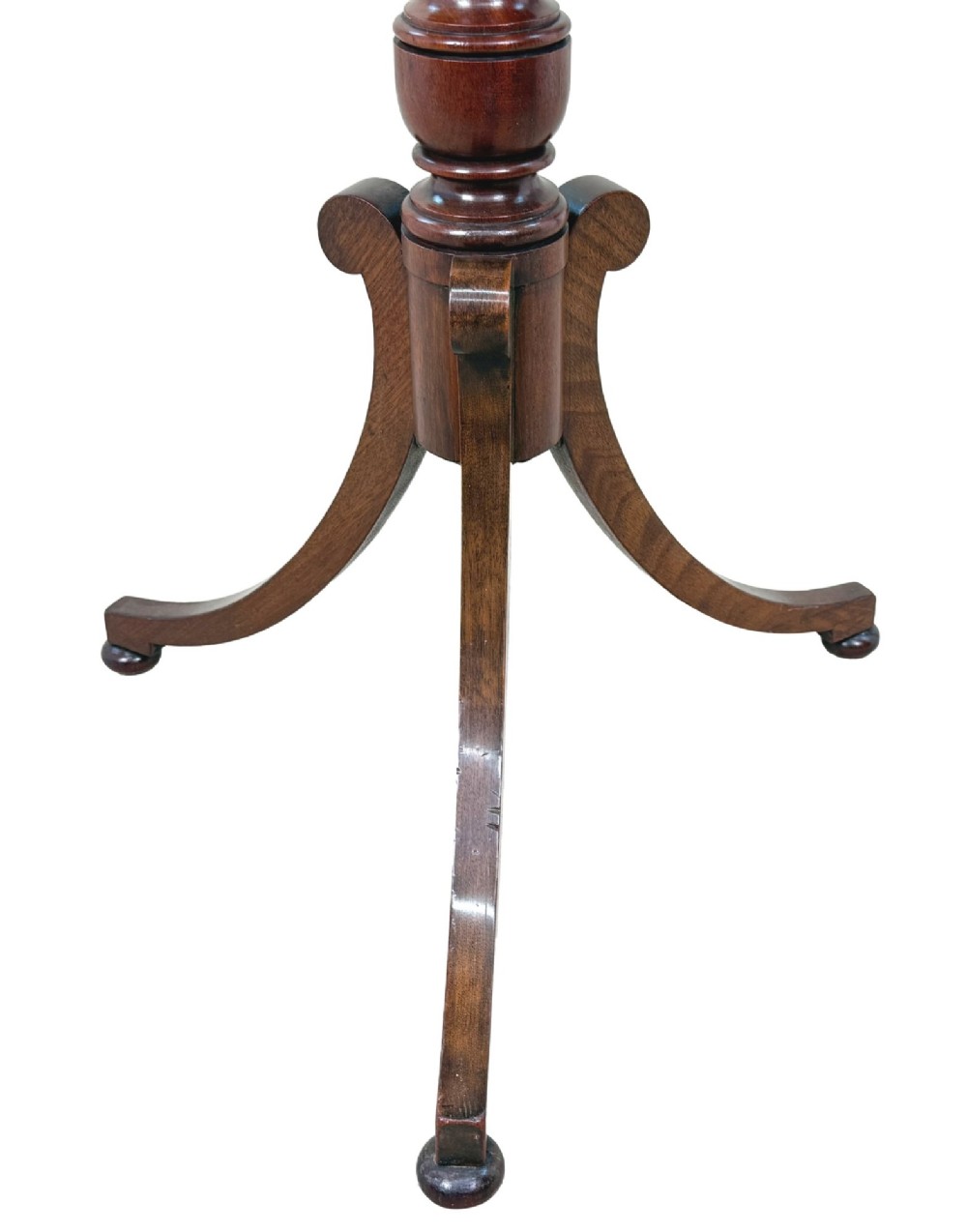 A Regency period mahogany wine table with a rectangular top, a turned central pedestal column, and three splayed legs ending in ball feet. View VII