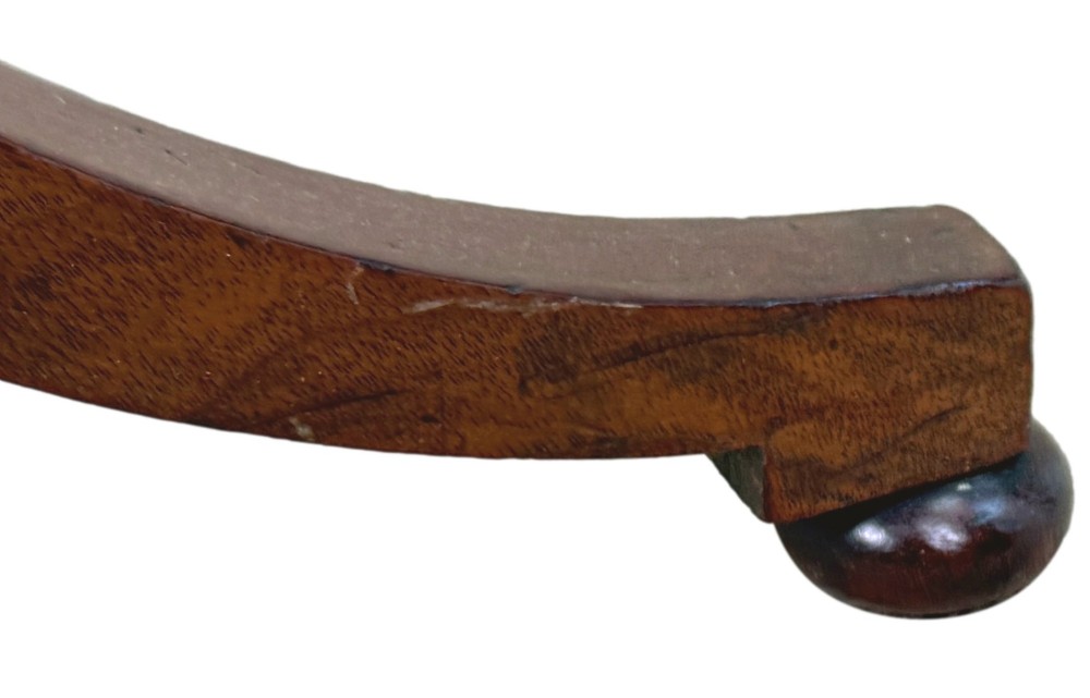 A Regency period mahogany wine table with a rectangular top, a turned central pedestal column, and three splayed legs ending in ball feet. View XI