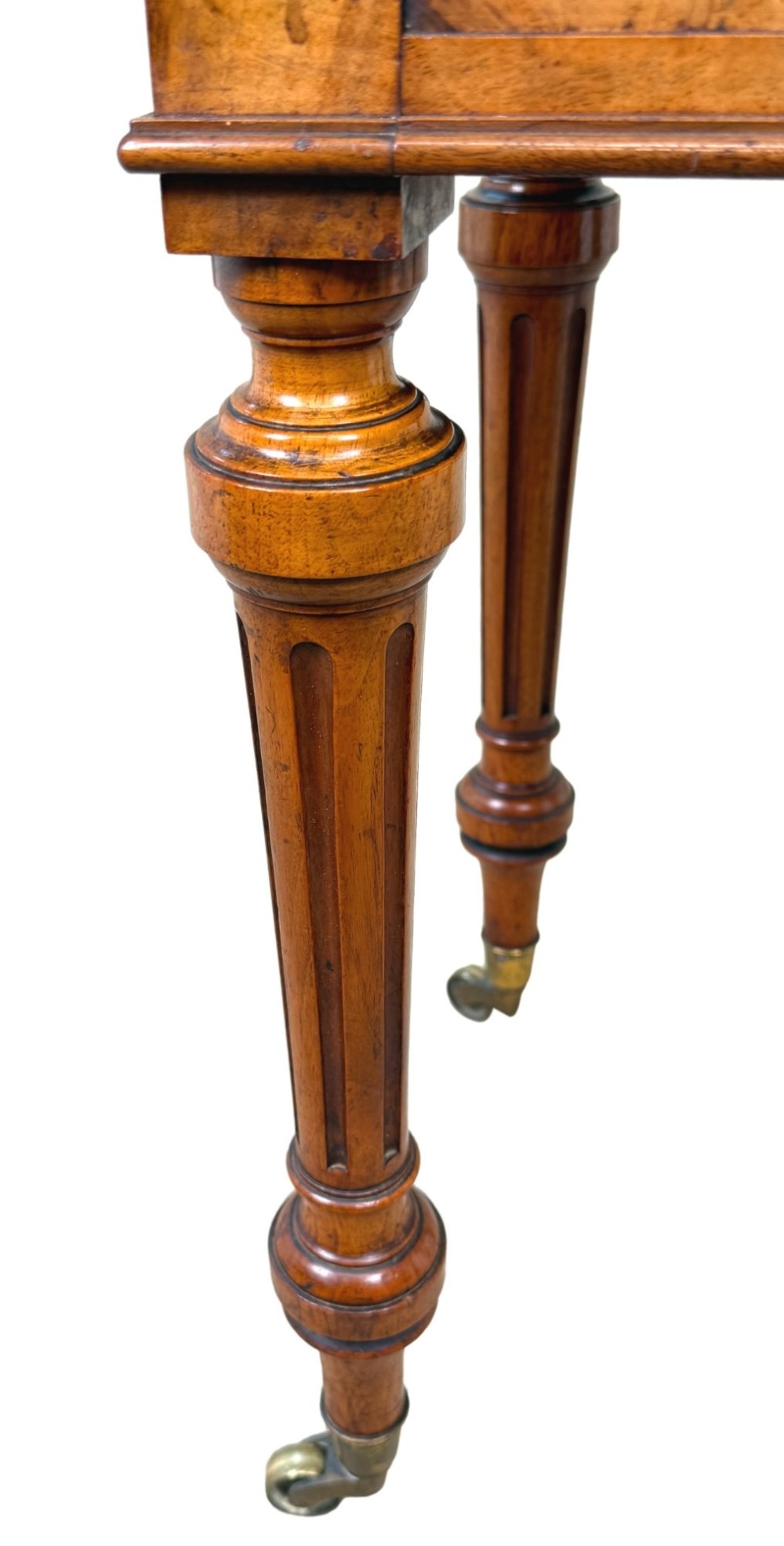 A 19th-century burr walnut Pembroke side table with a single drawer, two drop-down side leaves, turned fluted legs, and brass castors. View XII