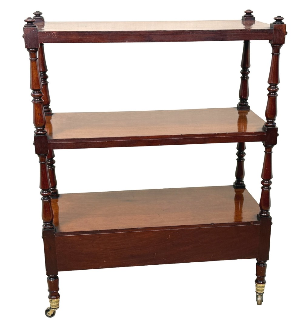 An early nineteenth-century Regency mahogany three-tiered etagere whatnot with turned supports, finials, a lower drawer, and brass castors. View VIII