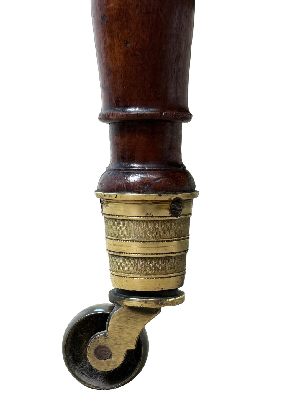 An early nineteenth-century Regency mahogany three-tiered etagere whatnot with turned supports, finials, a lower drawer, and brass castors. View XII