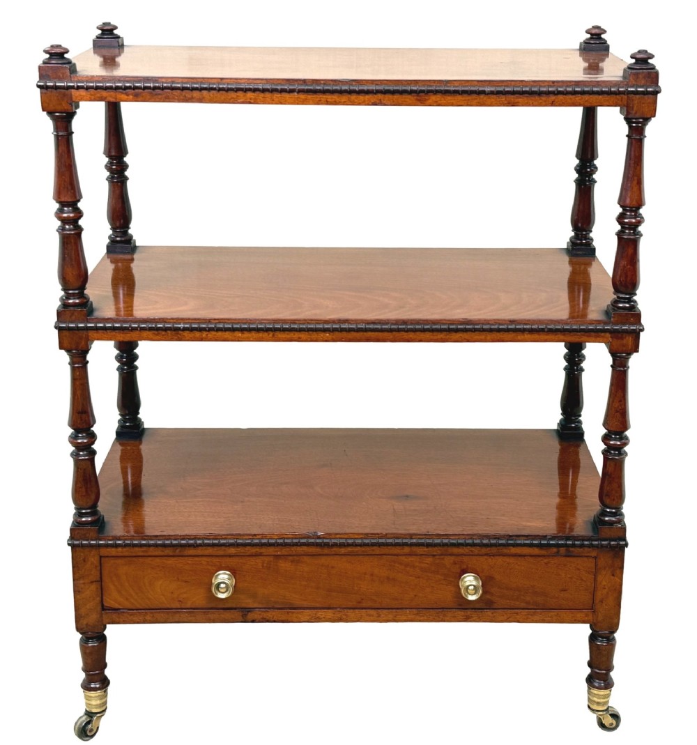An early nineteenth-century Regency mahogany three-tiered etagere whatnot with turned supports, finials, a lower drawer, and brass castors. View XIII