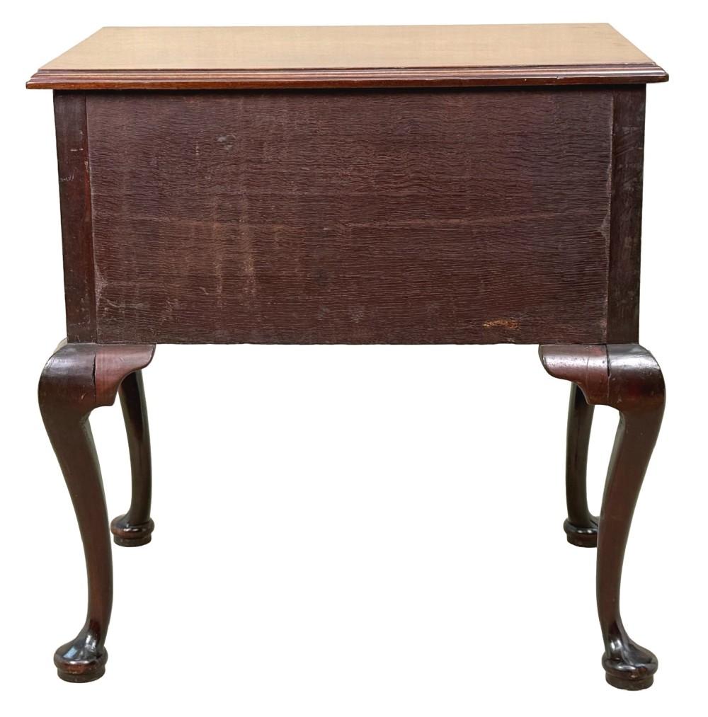 An early Georgian mahogany lowboy table featuring three drawers with brass handles, a shaped apron, and four cabriole legs. View XI
