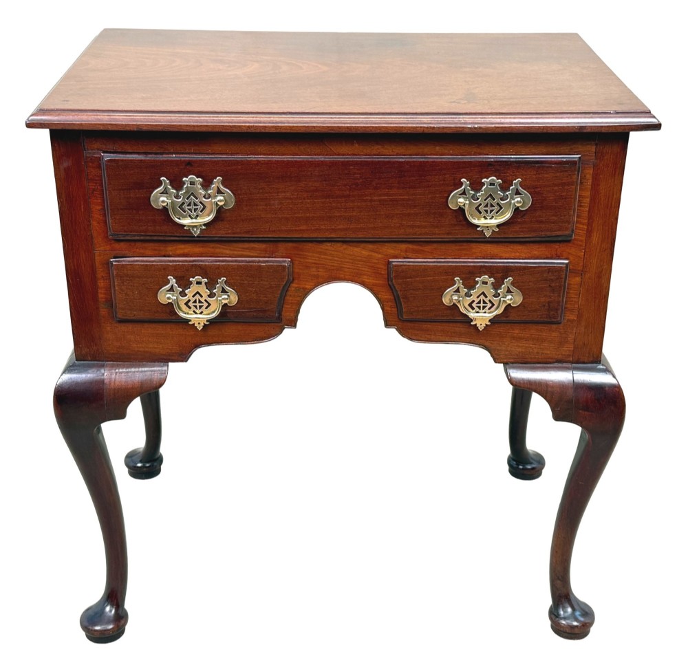An early Georgian mahogany lowboy table featuring three drawers with brass handles, a shaped apron, and four cabriole legs. View XII