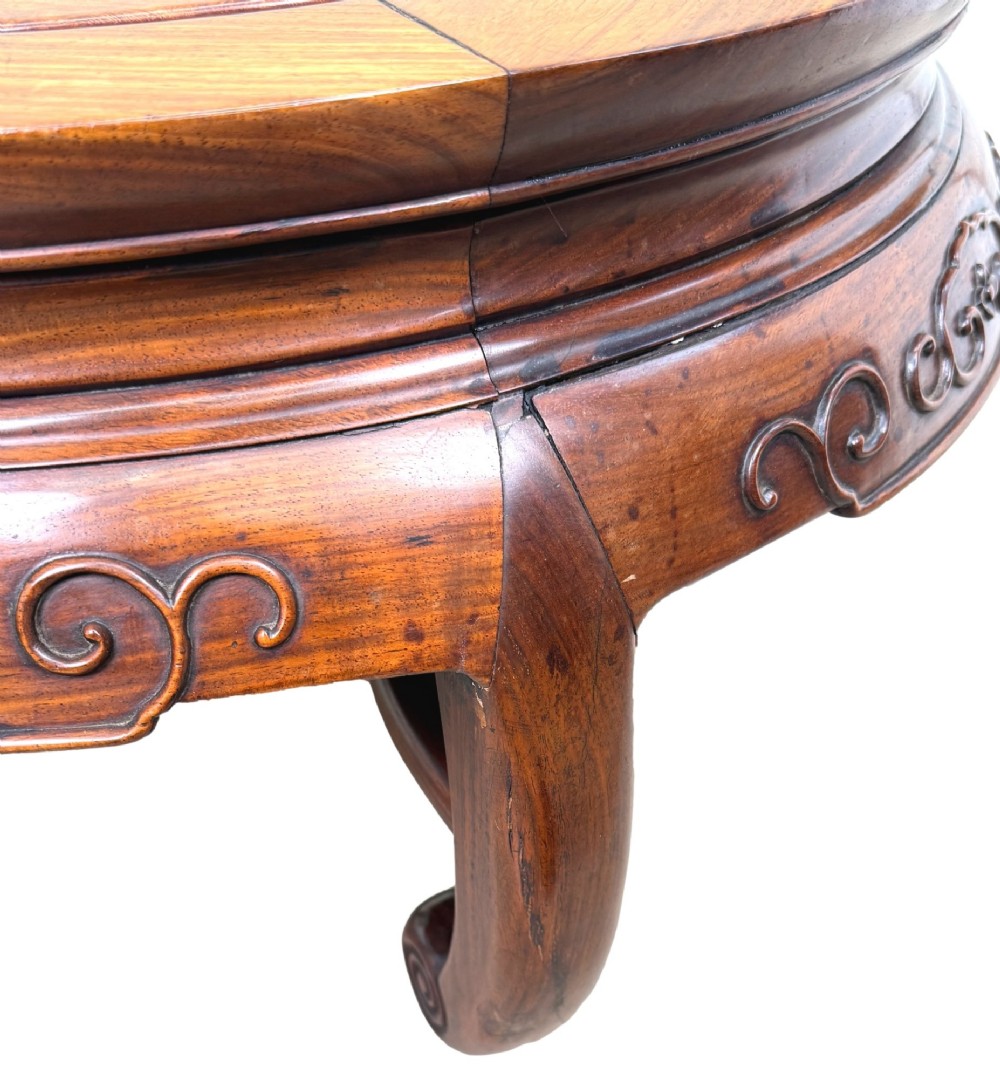 A circular 19th-century Chinese export hardwood coffee table featuring an inset burr wood top, carved scroll aprons, and curved legs. View III