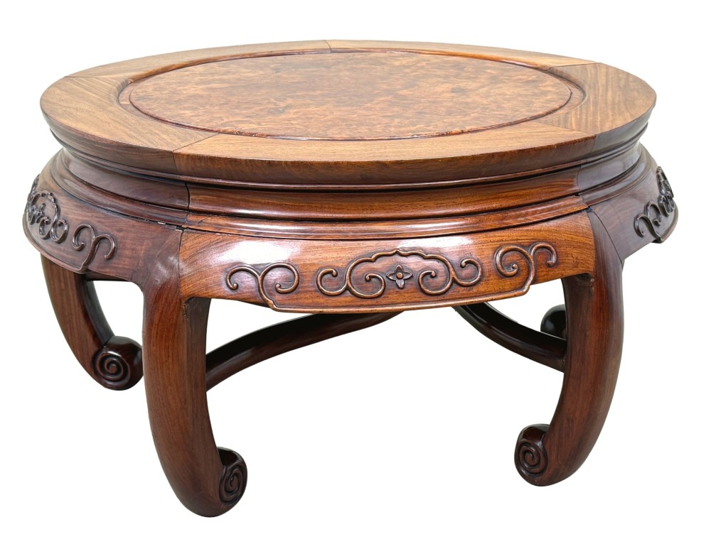 A circular 19th-century Chinese export hardwood coffee table featuring an inset burr wood top, carved scroll aprons, and curved legs. View VIII