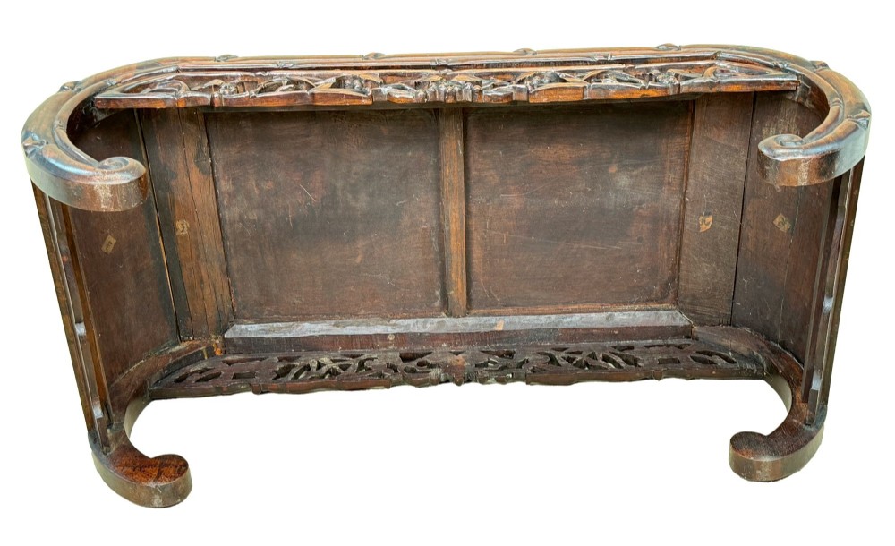 A 19th-century dark hardwood Chinese export opium coffee table featuring scrolled legs and intricately carved pierced floral aprons. View VIII