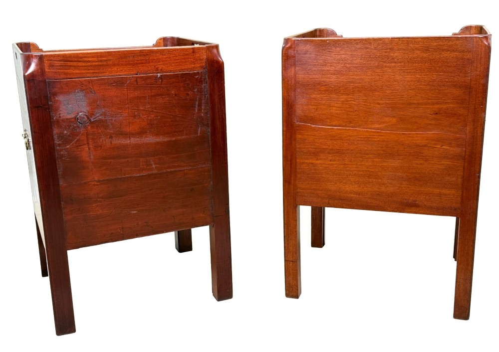 A matched pair of Georgian mahogany bedside tables featuring top tray galleries with cutout handles, double cupboard doors, lower drawers, and brass hardware. View IX