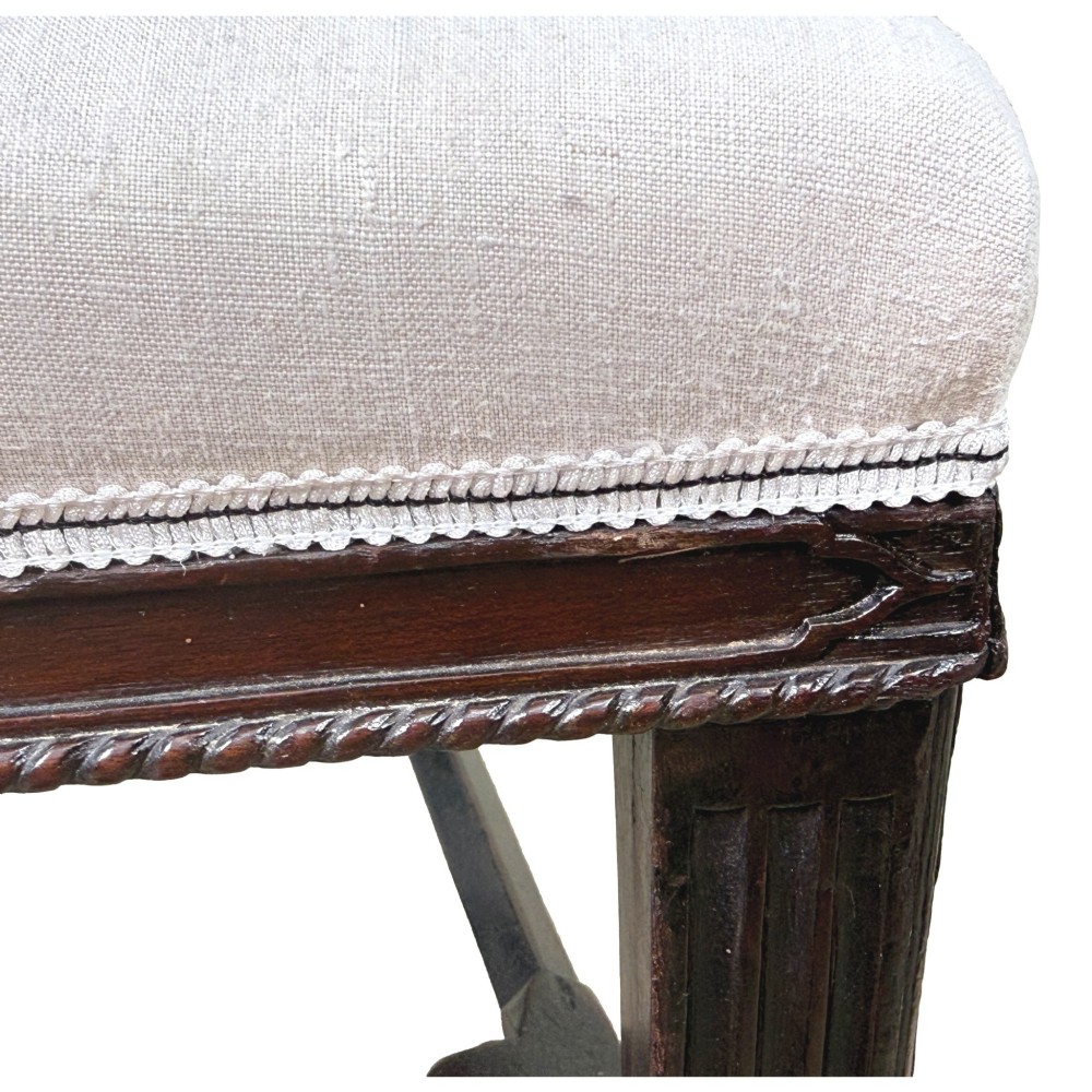 A pair of 18th-century Chippendale mahogany carver armchairs featuring intricately carved pierced back splats, curved arms, and neutral upholstered drop-in seats. View XIII