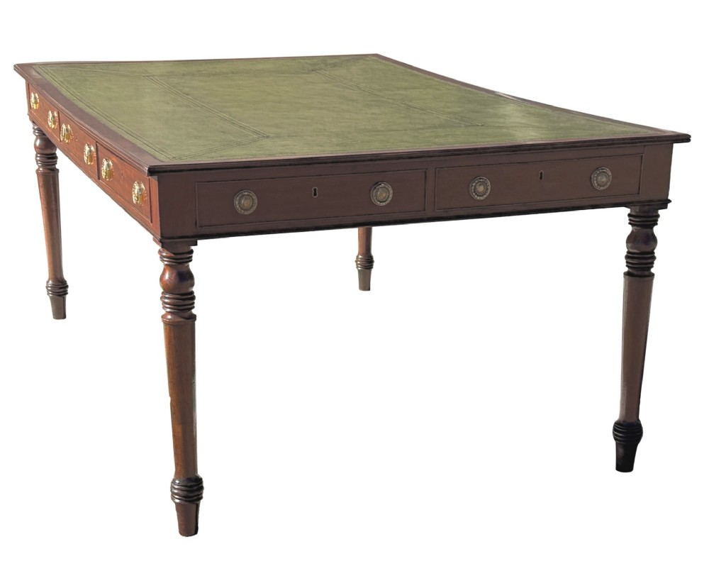 A large 19th-century Georgian mahogany partners writing table with frieze drawers, brass handles, turned legs, and a dark leather writing surface. View II