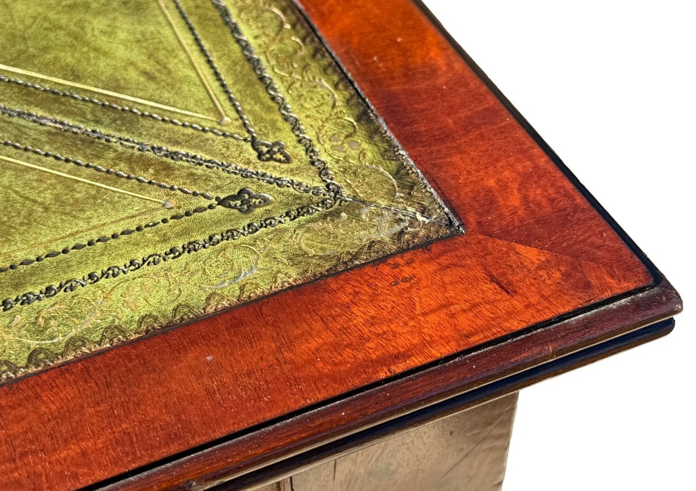 A large 19th-century Georgian mahogany partners writing table with frieze drawers, brass handles, turned legs, and a dark leather writing surface. View X