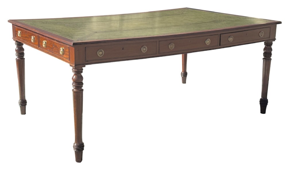 A large 19th-century Georgian mahogany partners writing table with frieze drawers, brass handles, turned legs, and a dark leather writing surface. View XI