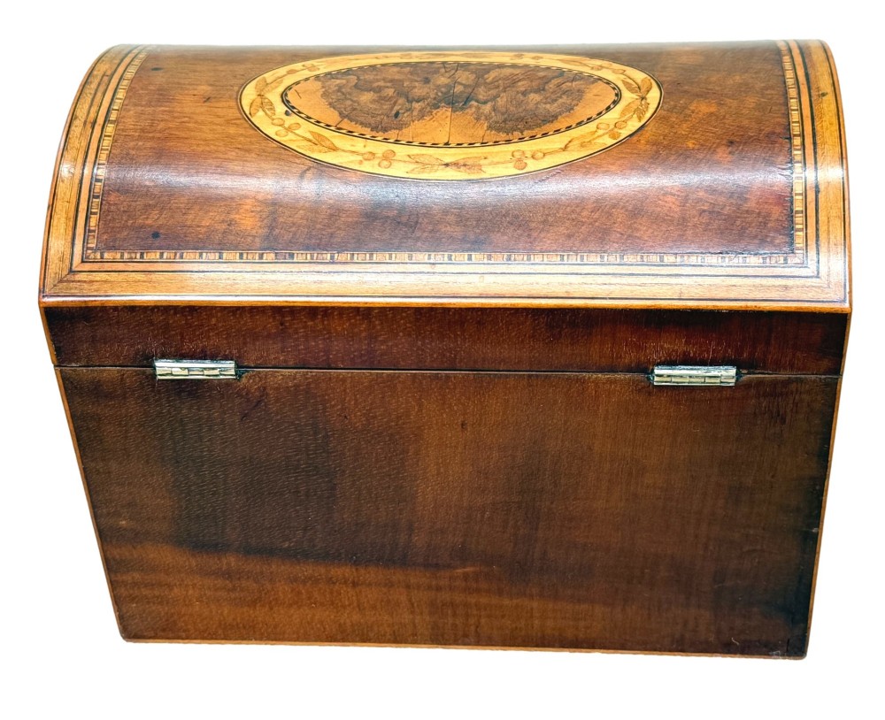 A late 18th-century George III wooden tea caddy featuring a domed lid, intricate marquetry inlay with central oval medallions, and geometric border stringing. View V