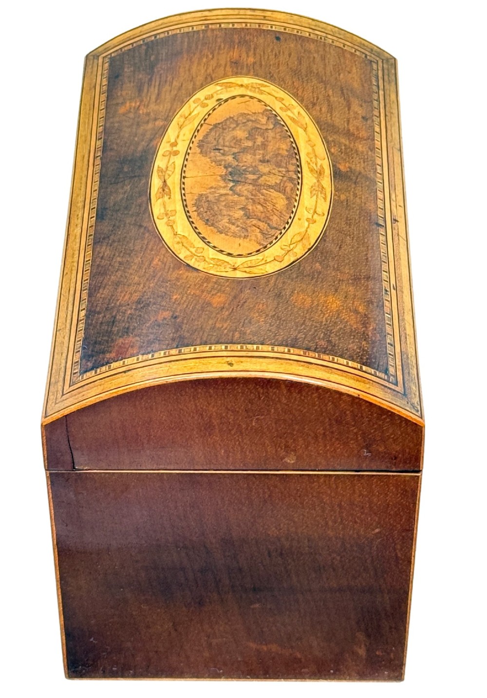 A late 18th-century George III wooden tea caddy featuring a domed lid, intricate marquetry inlay with central oval medallions, and geometric border stringing. View VII