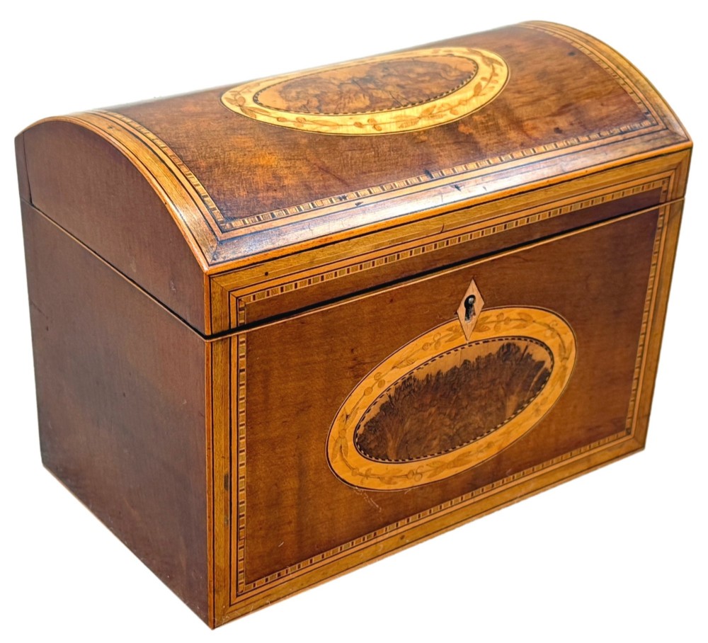 A late 18th-century George III wooden tea caddy featuring a domed lid, intricate marquetry inlay with central oval medallions, and geometric border stringing. View VIII