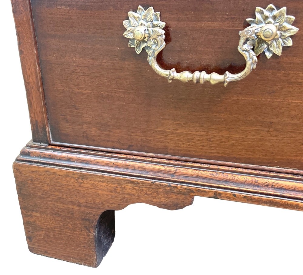 A Georgian mahogany bureau bookcase featuring an upper mirrored cabinet door above a slant-front desk and three lower drawers. View V