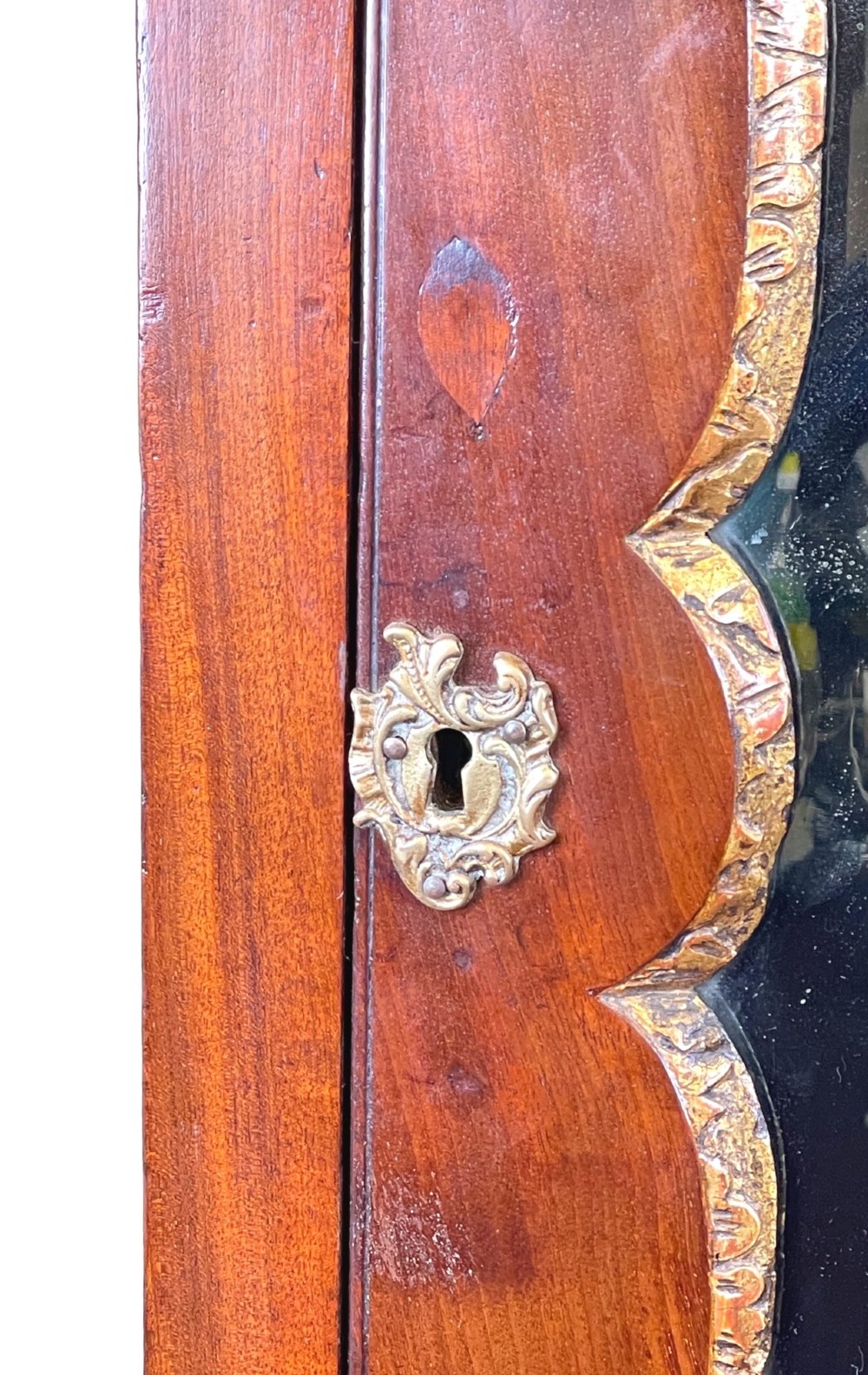 A Georgian mahogany bureau bookcase featuring an upper mirrored cabinet door above a slant-front desk and three lower drawers. View IX