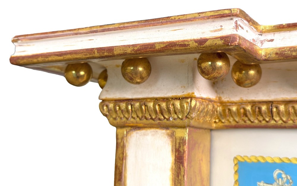 A pair of tall early 19th-century Regency pier mirrors featuring gilded pilasters, breakfront cornices, and upper painted panels depicting maritime sailing vessels. View XII