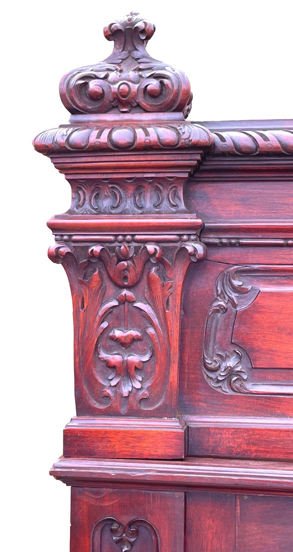 A 19th-century dark mahogany display cabinet featuring a carved crest, glazed doors, and lower support with carved lion mask legs. View XII