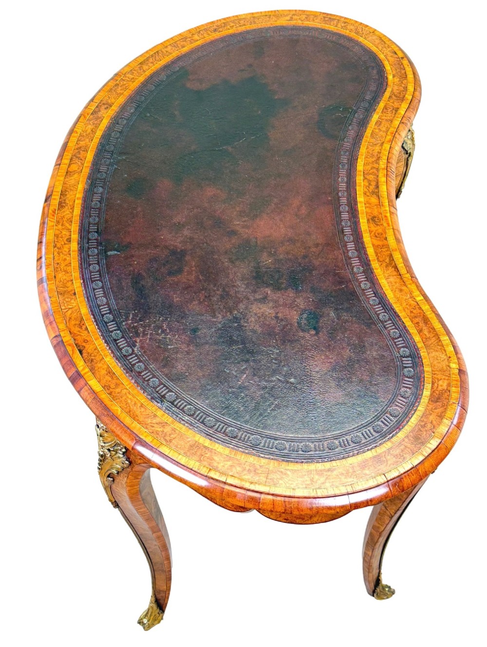 A 19th-century burr walnut kidney-shaped writing table featuring an inset leather top, gilt bronze espagnolette mounts, and cabriole legs. View III