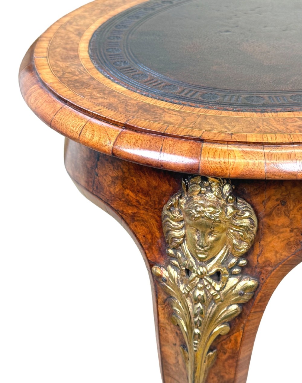 A 19th-century burr walnut kidney-shaped writing table featuring an inset leather top, gilt bronze espagnolette mounts, and cabriole legs. View VI