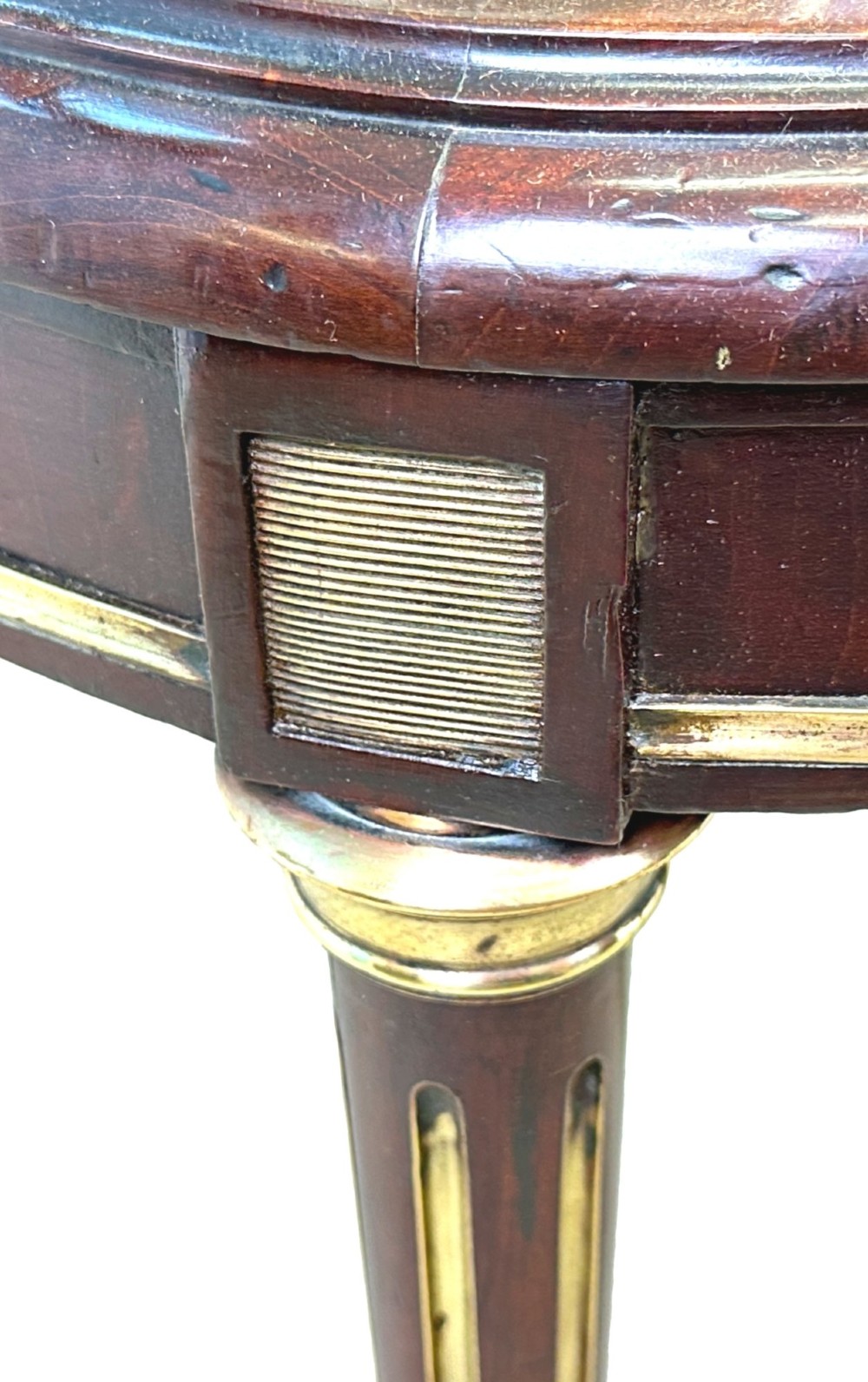 A pair of 19th-century French mahogany curved-back salon chairs with brass mounts, spindle details, woven cane seats, and turned front legs. View VI