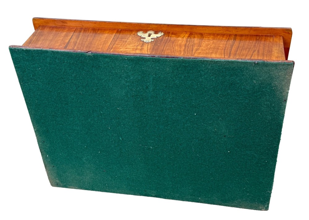 A shallow rectangular William and Mary period wooden box with laburnum oyster veneered patterns, concentric circular stringing on the lid, and a brass keyhole escutcheon on the front panel. View XI