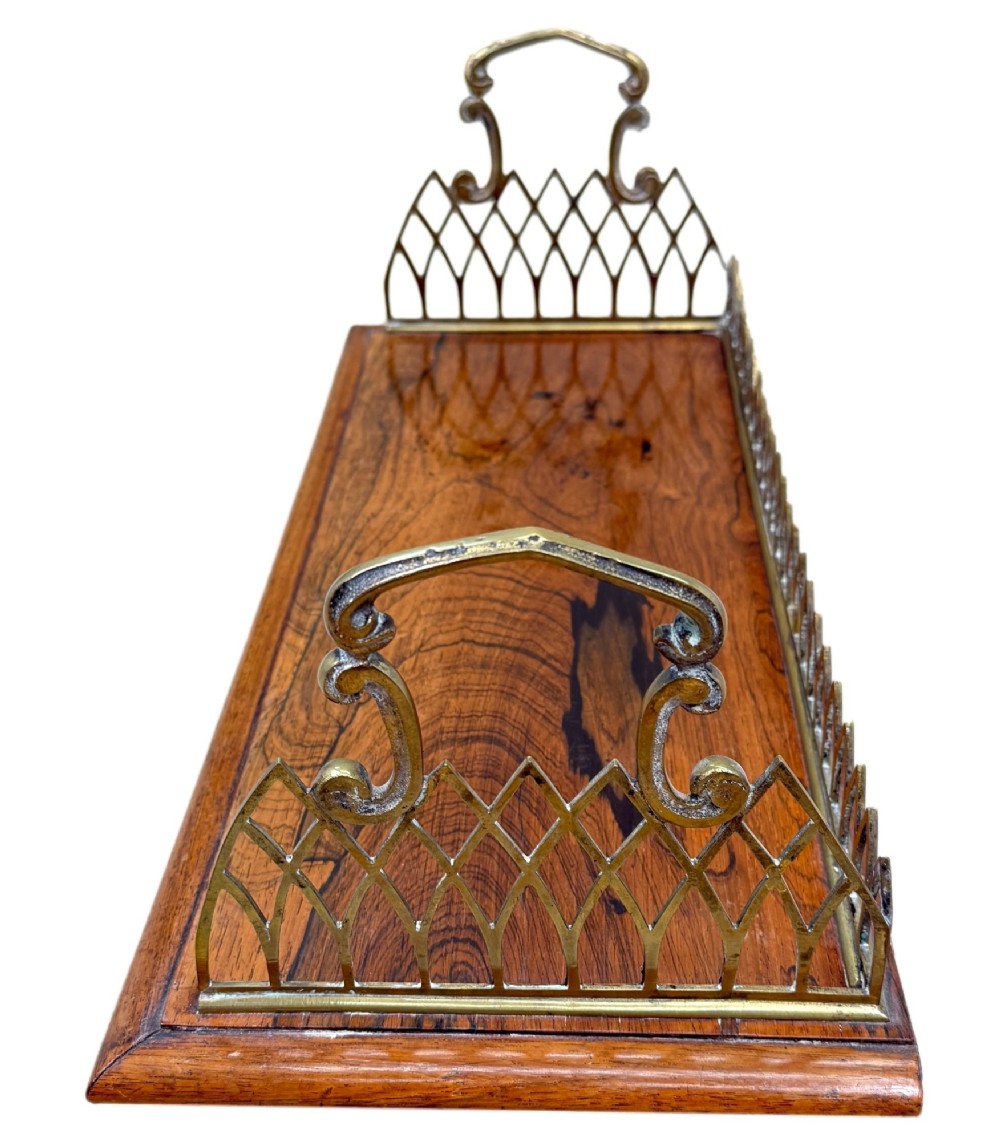 A rectangular rosewood desk tray with a polished grain surface, featuring decorative pointed brass gallery borders and arched carrying handles at each end. View II