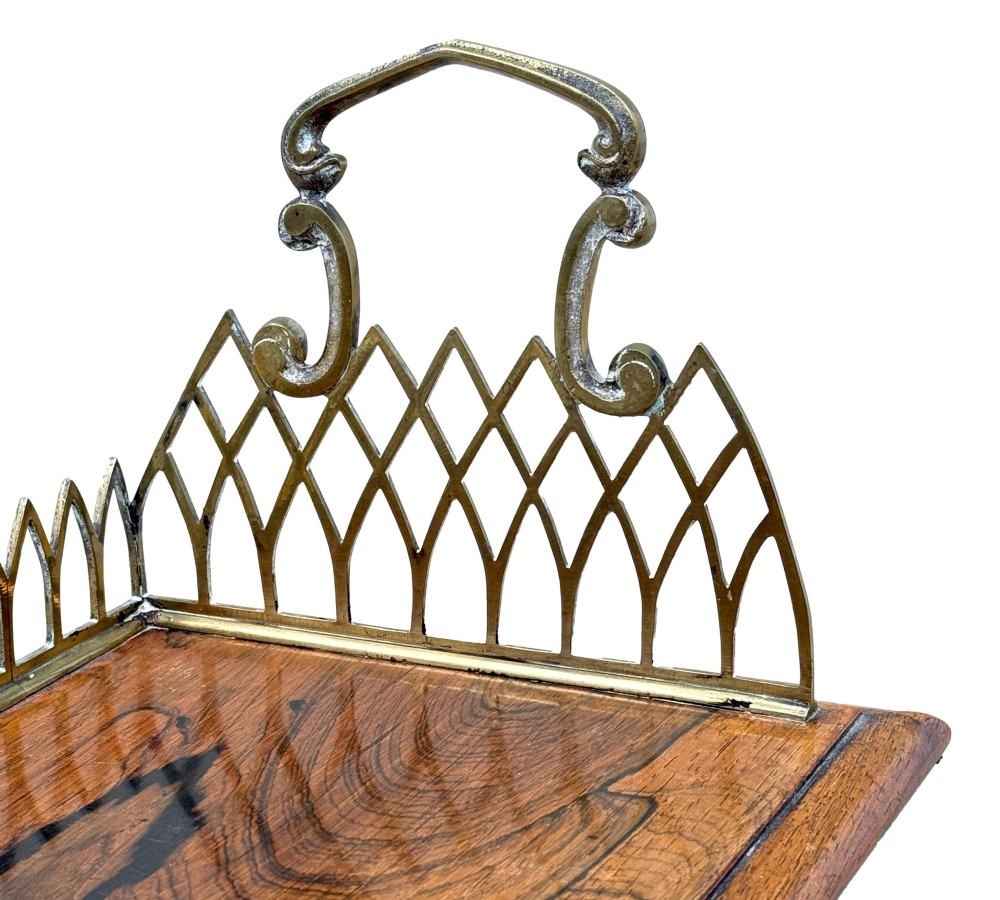 A rectangular rosewood desk tray with a polished grain surface, featuring decorative pointed brass gallery borders and arched carrying handles at each end. View IV