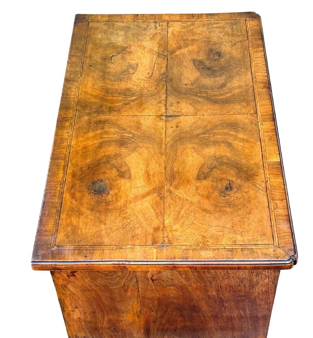 An early 18th-century George I walnut lowboy with four drawers, brass drop handles, a shaped apron, and cabriole legs with pad feet. View III