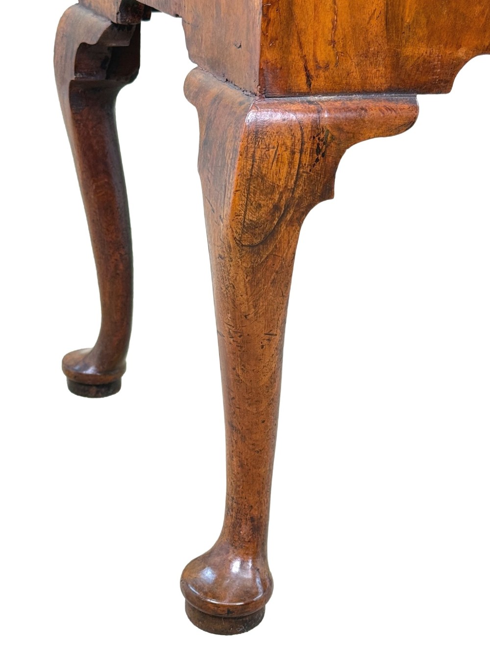 An early 18th-century George I walnut lowboy with four drawers, brass drop handles, a shaped apron, and cabriole legs with pad feet. View IV