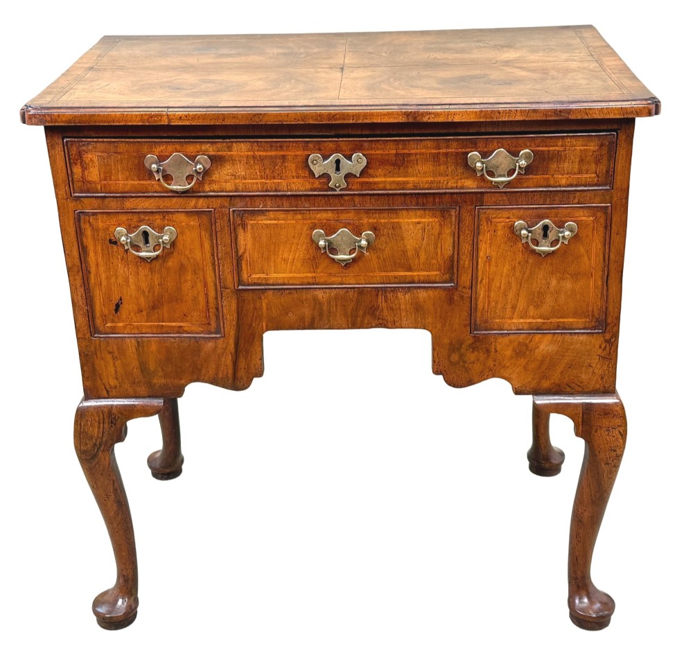 An early 18th-century George I walnut lowboy with four drawers, brass drop handles, a shaped apron, and cabriole legs with pad feet. View XII