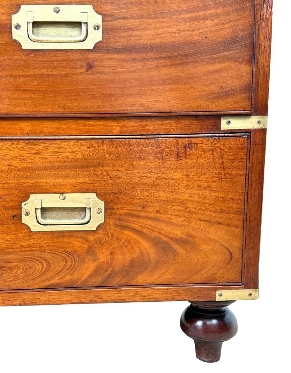 A mid-19th century camphor wood military campaign chest of drawers featuring brass corner brackets, flush handles, and two separate stacking sections on turned feet. View XIII