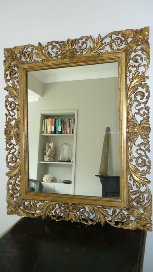 19th Century Carved Gilt Masked Florentine Mirror