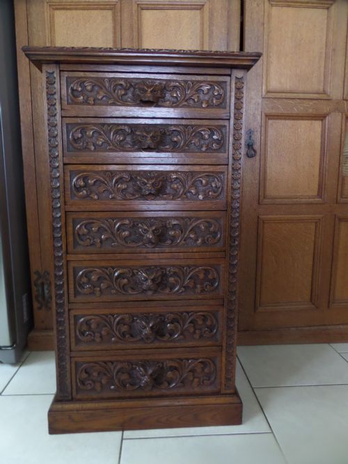 19th Century Carved Oak Wellington Chest of Drawers Green Man Handles