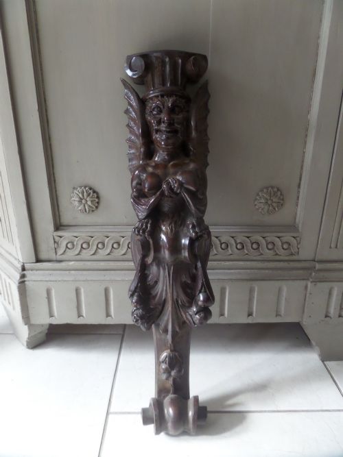 19th Century Carved Walnut Winged Masked Mythical Figure