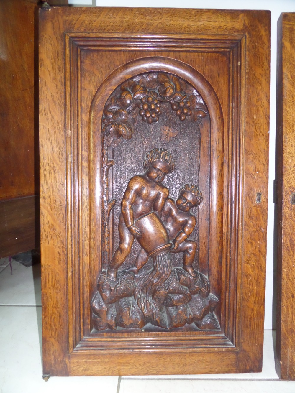 19th Century Carved Oak Cherub Panel in a Vinyard