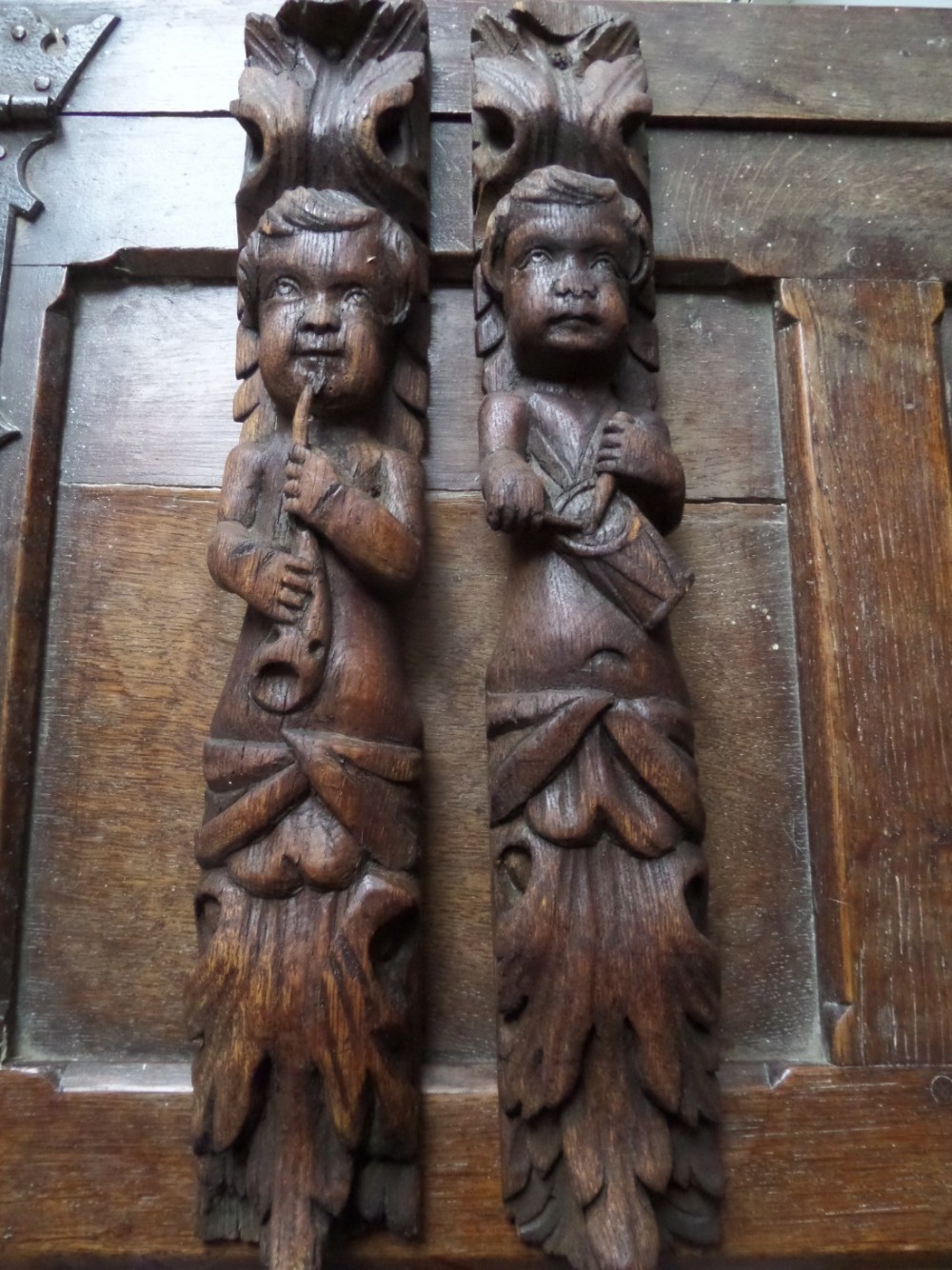19th Century Carved Oak Caryatids playing a musical instrument