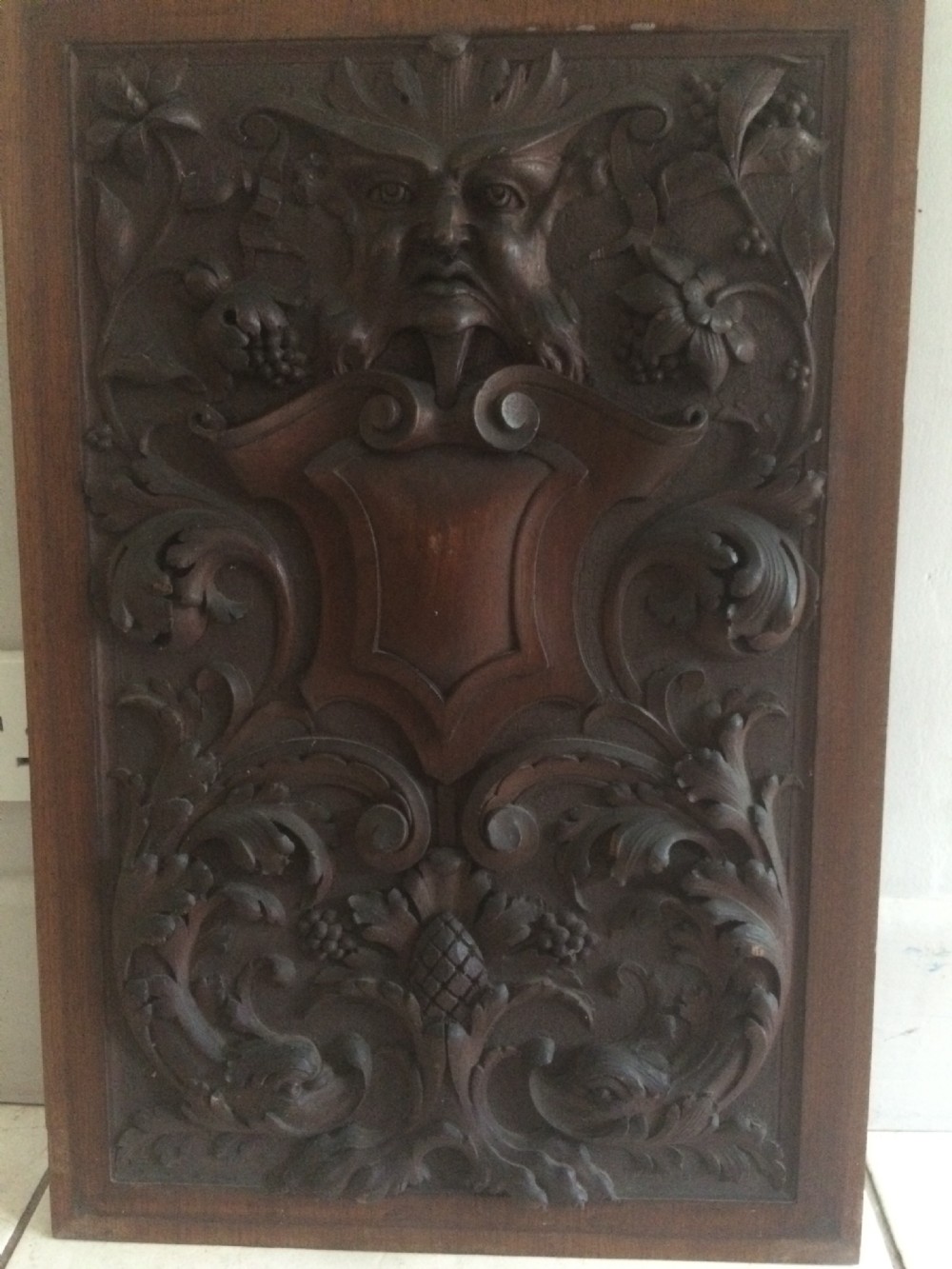 19th Century Carved Walnut Panel Horned Devil, Dolphins and Lion Claw Feet