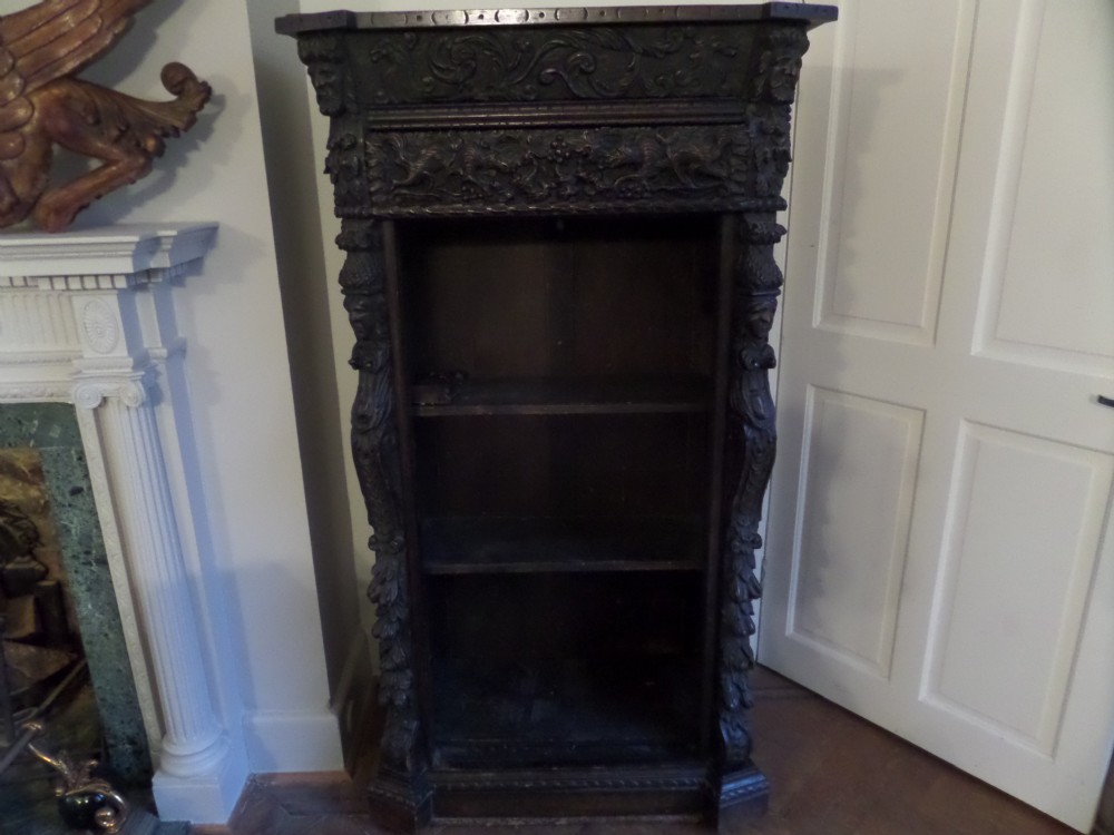 19th Century Heavily Carved Oak Bookcase with Carved Hunting Dogs.