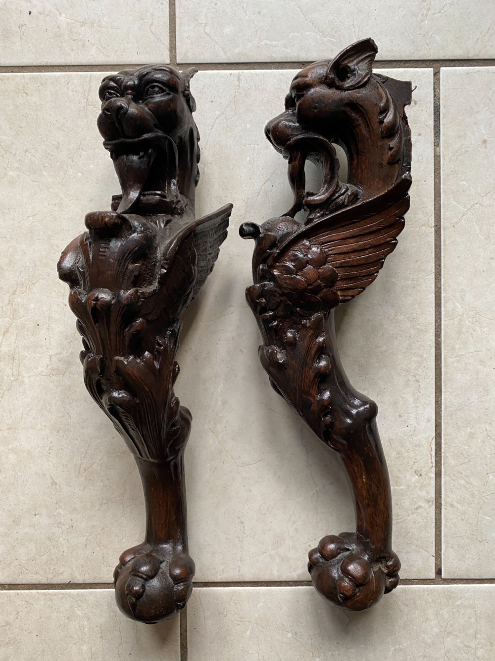 Carved Oak Winged Griffin Caryatids with ball and claw feet. 