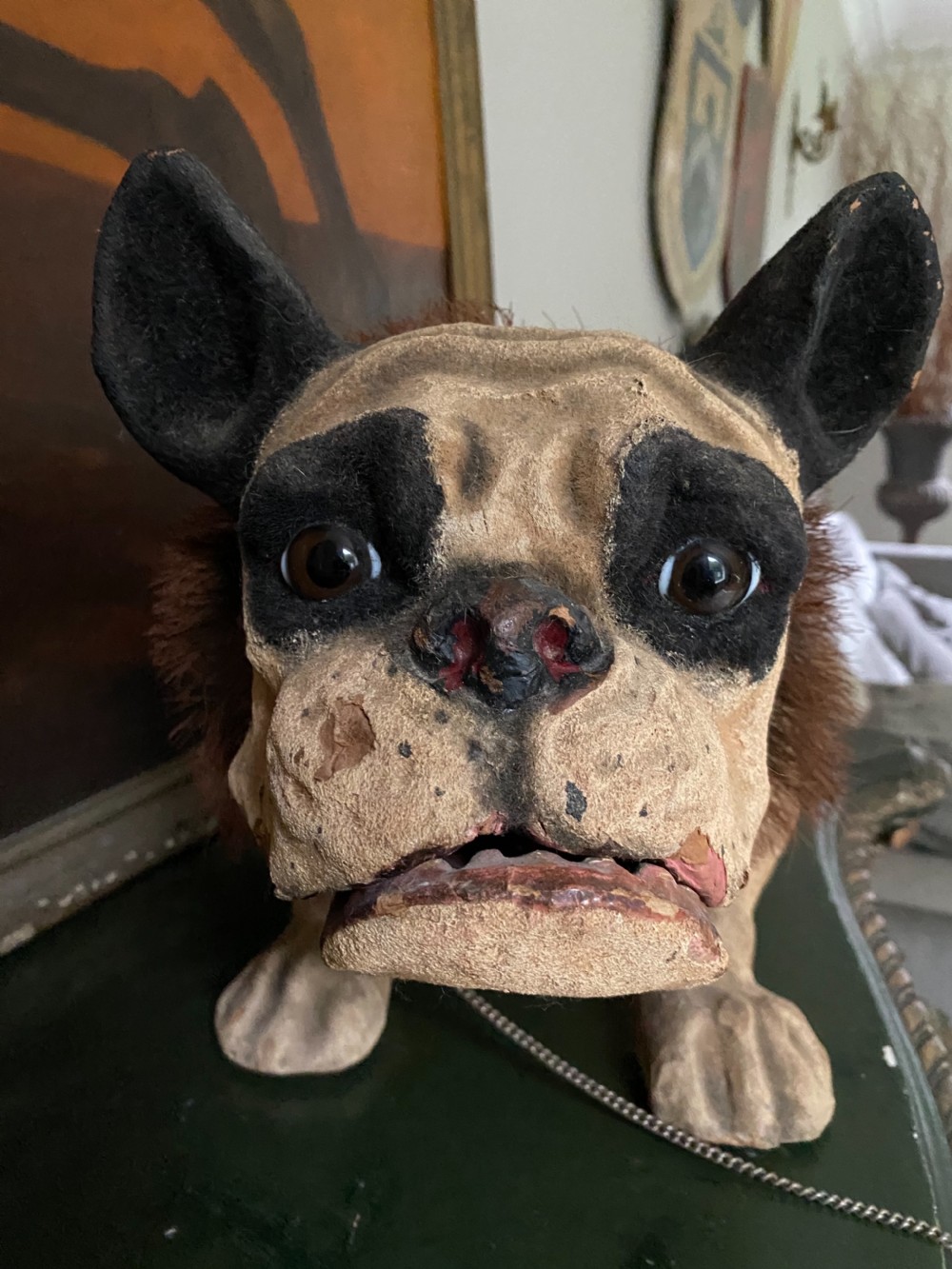 A 19th-century papier-mache French bulldog figure featuring painted cream skin, black eye patches, glass eyes, a dark fur collar, and a metal chain leash. View II