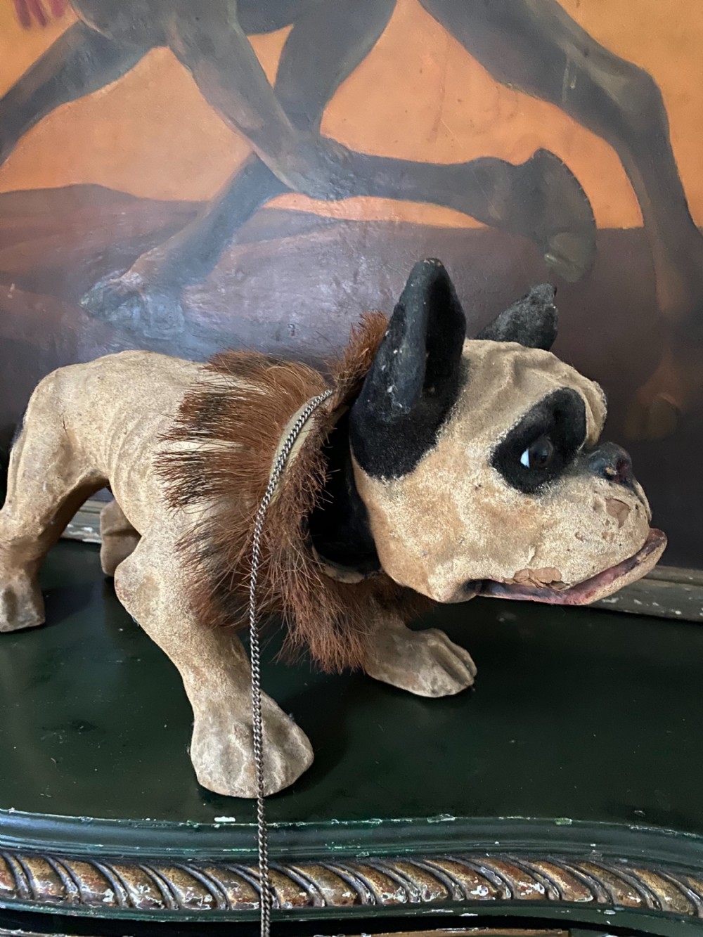 A 19th-century papier-mache French bulldog figure featuring painted cream skin, black eye patches, glass eyes, a dark fur collar, and a metal chain leash. View III