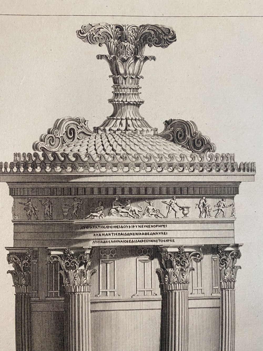 An 18th-century black and white architectural line engraving depicting a tall classical monument with Corinthian columns and decorative acanthus finial. View II
