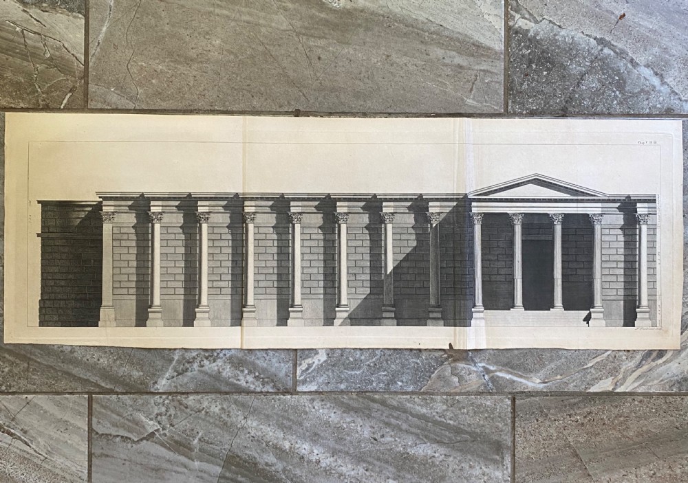 A wide 18th-century monochrome architectural engraving displaying a detailed elevation view of a classical temple with columns.