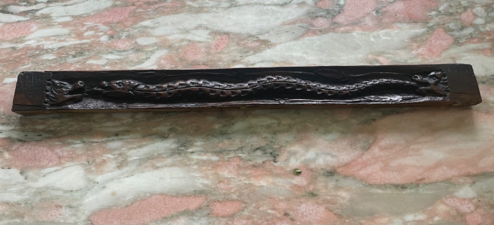 Period oak Carved Oak Panel with a Snake and Griffins
