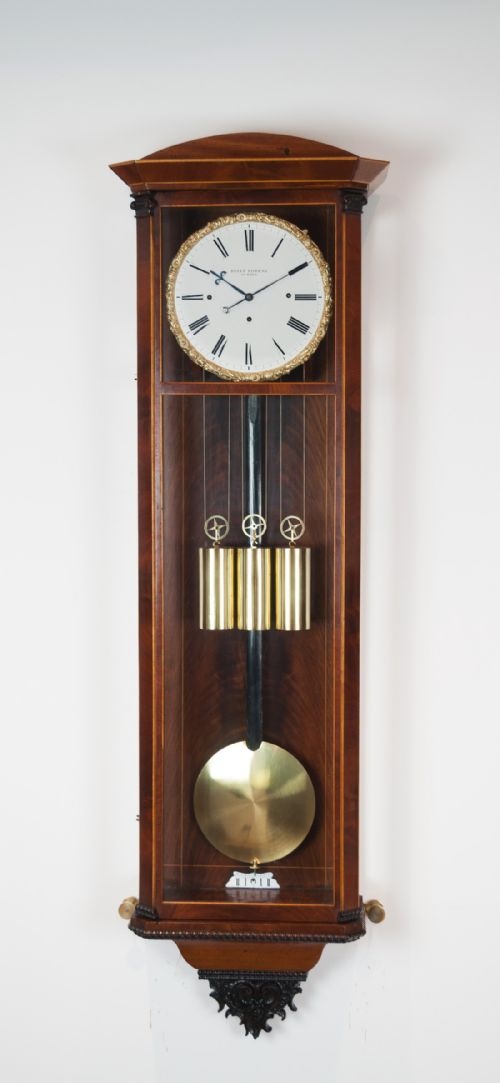 A Flame Mahogany Biedermeier Viennese Wall Regulator, Circa 1850